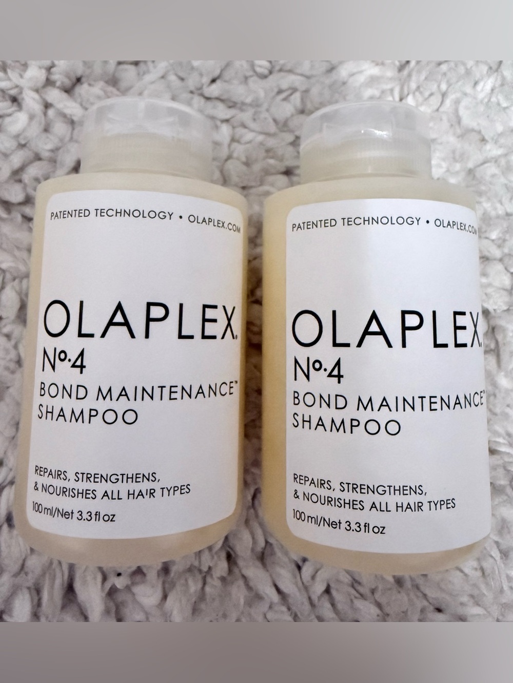 OLAPLEX No.4 Bond Maintenance Shampoo - White and Cream Bottles